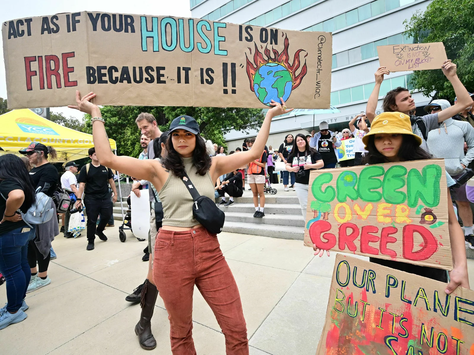 Youthful activists hold signs while participating in a Climate Strike rally on September 15 in Los Angeles.