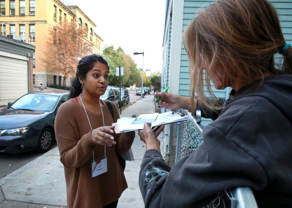 Canvasser Heleena Mathew (left) spoke with Tanya Saar on Green Street in Jamaica Plain. JOHN BLANDING/GLOBE STAFF