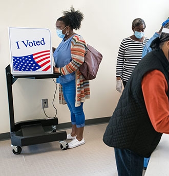 People cast votes at the Richland County Voter Registration and Elections Office on the second day of in-person absentee and early voting on Oct. 6, 2020 in Columbia, South Carolina. Credit: Sean Rayford/Getty Images