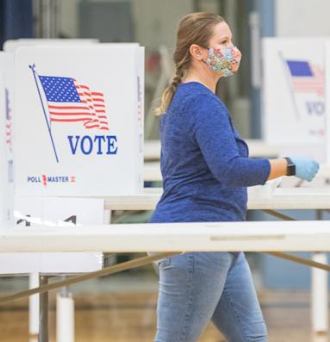 An election worker at a polling location in Hermon, Maine. 