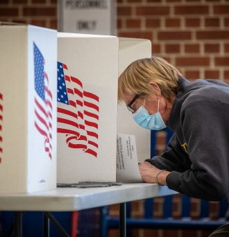 A voter casts their ballot at a polling place 